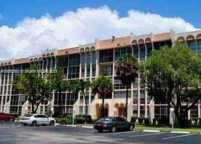801 Three Islands Blvd Unit 411, Hallandale Beach, FL 33009 - view of property featuring uncovered parking