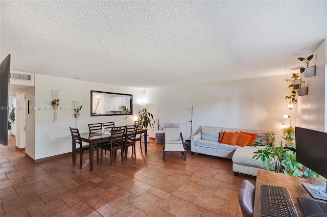 living room with a textured ceiling