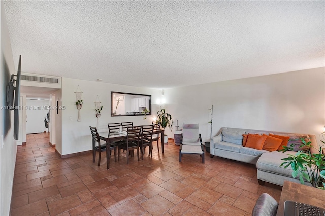 living room with a textured ceiling