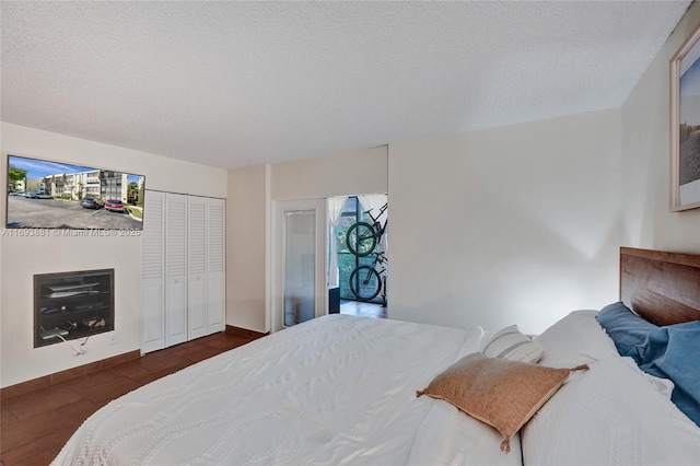 bedroom with a closet and a textured ceiling