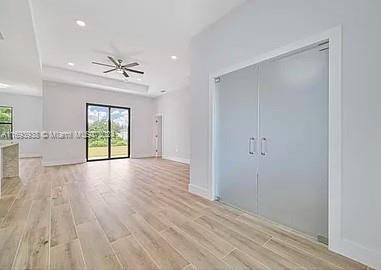 interior space featuring access to outside and light hardwood / wood-style flooring