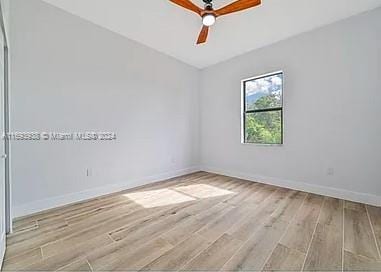 unfurnished room with ceiling fan and light hardwood / wood-style flooring