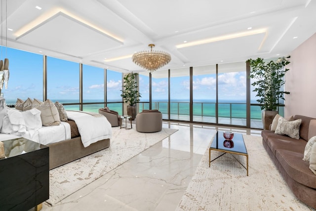 bedroom featuring floor to ceiling windows and a water view