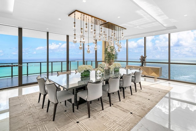 sunroom / solarium featuring a water view