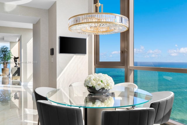 dining area featuring a notable chandelier