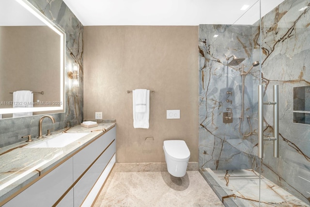 bathroom featuring tiled shower, vanity, and toilet