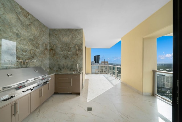 view of patio / terrace featuring an outdoor kitchen, sink, and area for grilling