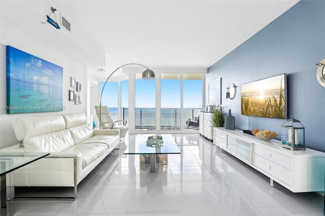 living room with light tile patterned floors and expansive windows