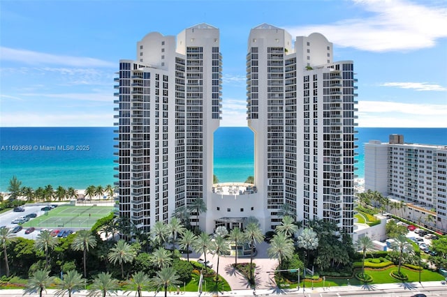 view of building exterior with a water view