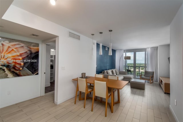 2602 E Hallandale Beach Blvd Unit R1606, Hallandale Beach, FL 33009 - dining room with light wood finished floors and baseboards