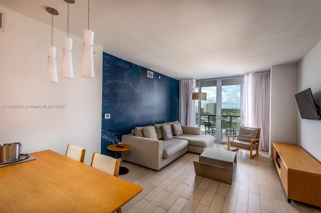 living room featuring floor to ceiling windows