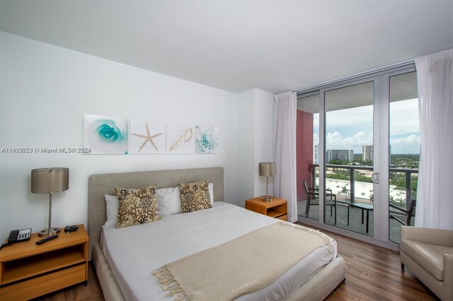 2602 E Hallandale Beach Blvd Unit R1606, Hallandale Beach, FL 33009 - bedroom featuring access to outside, wood finished floors, and a wall of windows
