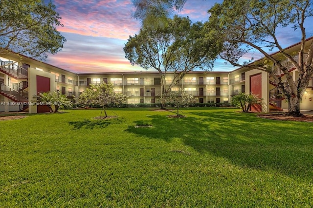13500 SW 1st St Unit 307U, Pembroke Pines, FL 33027 - yard at dusk with a yard