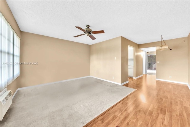 13500 SW 1st St Unit 307U, Pembroke Pines, FL 33027 - spare room featuring plenty of natural light, light wood-style floors, baseboards, and a textured ceiling
