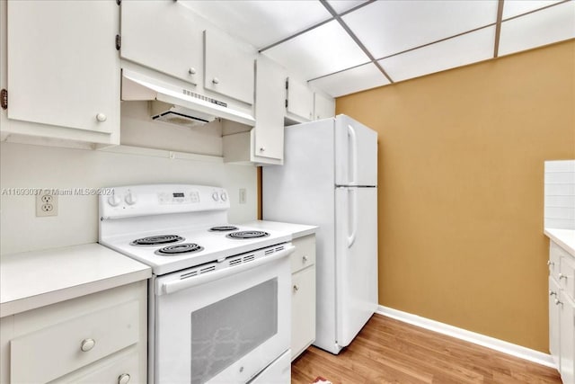 kitchen featuring white appliances, light hardwood / wood-style flooring, white cabinetry, and a paneled ceiling