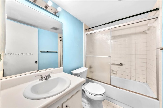 13500 SW 1st St Unit 307U, Pembroke Pines, FL 33027 - bathroom featuring vanity, toilet, and bath / shower combo with glass door