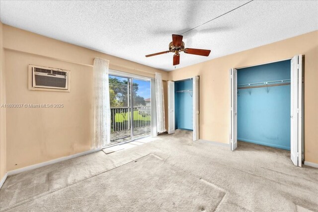 13500 SW 1st St Unit 307U, Pembroke Pines, FL 33027 - unfurnished bedroom with access to outside, carpet floors, multiple closets, baseboards, and a textured ceiling