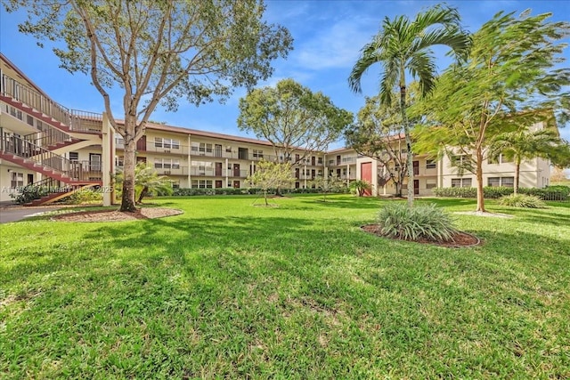 13500 SW 1st St Unit 307U, Pembroke Pines, FL 33027 - surrounding community with a yard