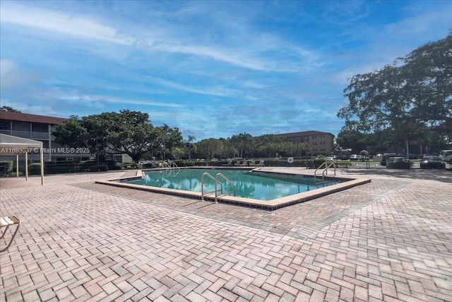 13500 SW 1st St Unit 307U, Pembroke Pines, FL 33027 - community pool featuring a patio area