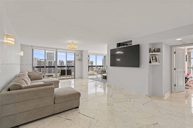 living room featuring a notable chandelier