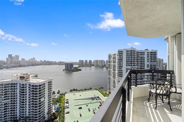 balcony with a water view and central AC