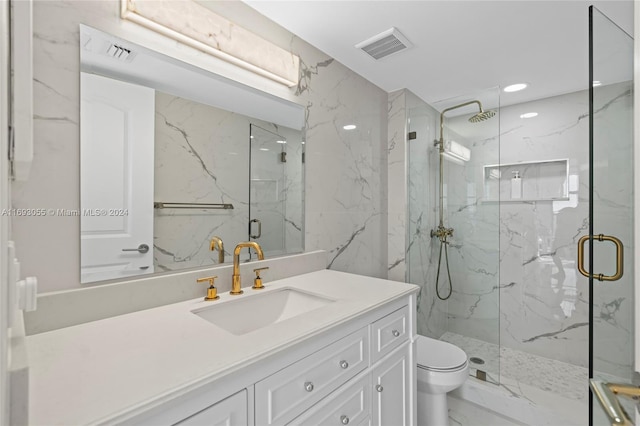 bathroom featuring vanity, toilet, and a shower with door