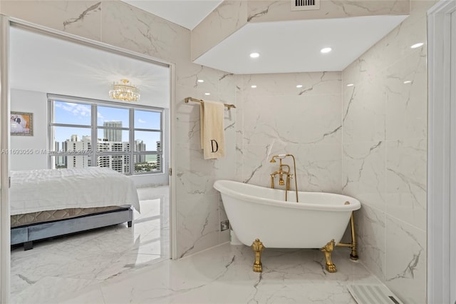 bathroom with a bathing tub and tile walls