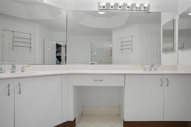 bathroom with vanity, tile patterned floors, and an enclosed shower