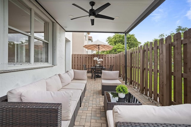 view of patio featuring an outdoor living space and ceiling fan