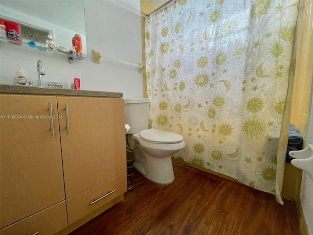 bathroom featuring a shower with shower curtain, toilet, and wood-type flooring