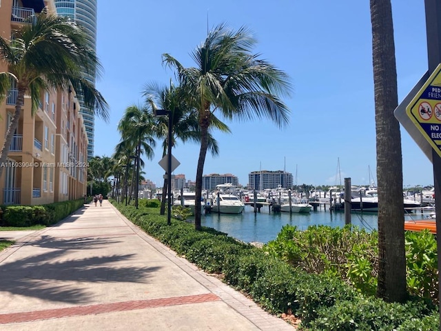 surrounding community featuring a water view