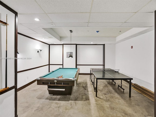 playroom with concrete floors, a paneled ceiling, and pool table