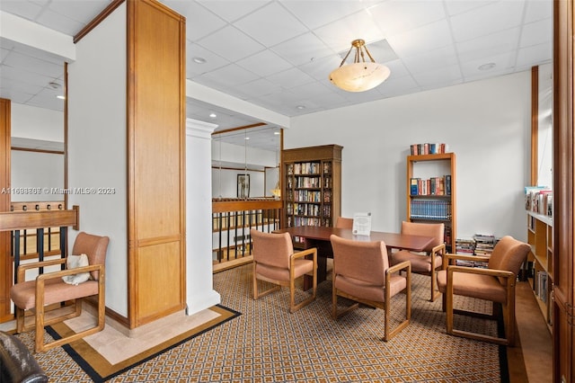 sitting room featuring a paneled ceiling