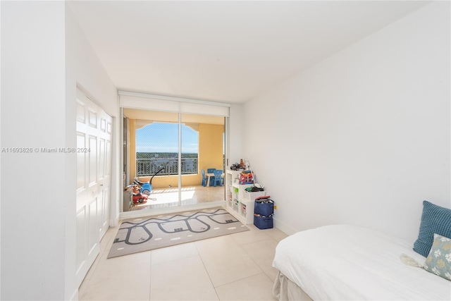 bedroom with light tile patterned floors