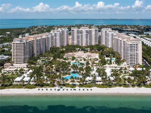 aerial view with a water view and a view of the beach