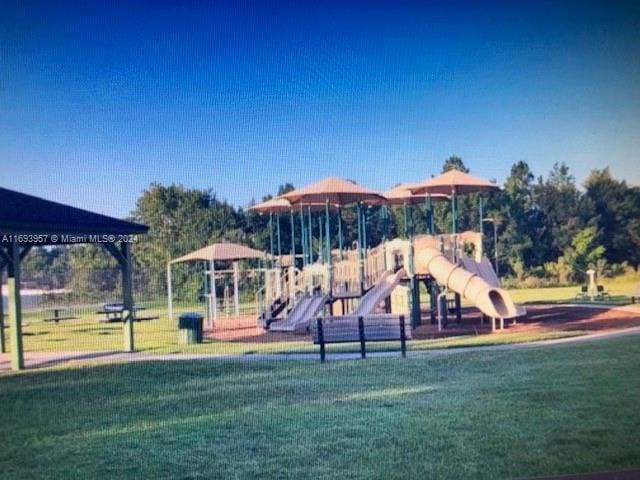 view of jungle gym featuring a yard