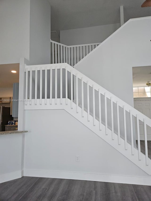 stairway with hardwood / wood-style flooring