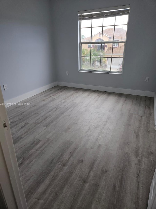 unfurnished room featuring hardwood / wood-style floors