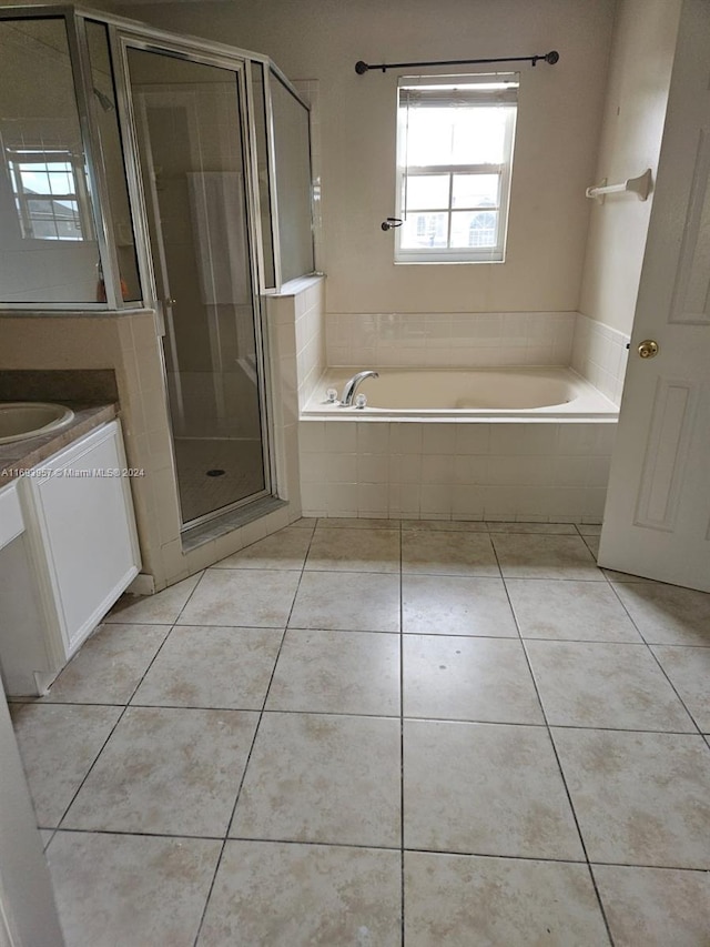 bathroom with vanity, tile patterned floors, and independent shower and bath