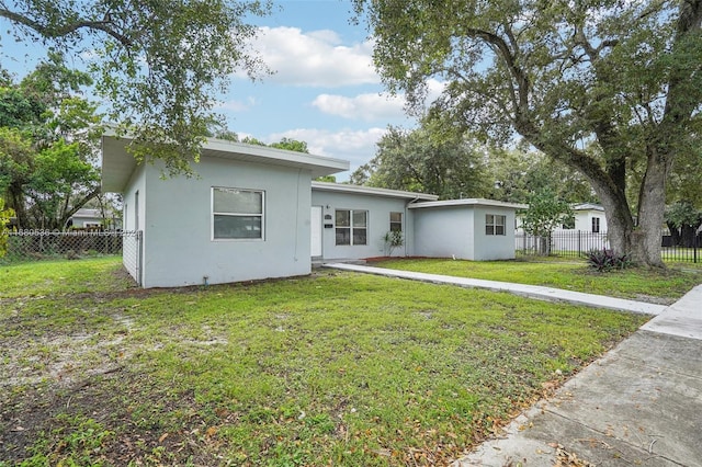 view of front of home with a front lawn