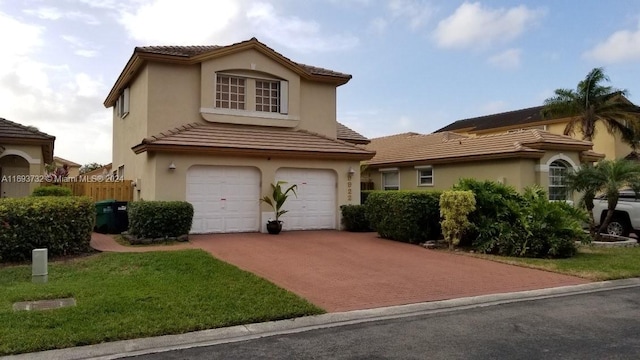 view of front of house featuring a garage and a front yard