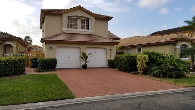 mediterranean / spanish home with a garage