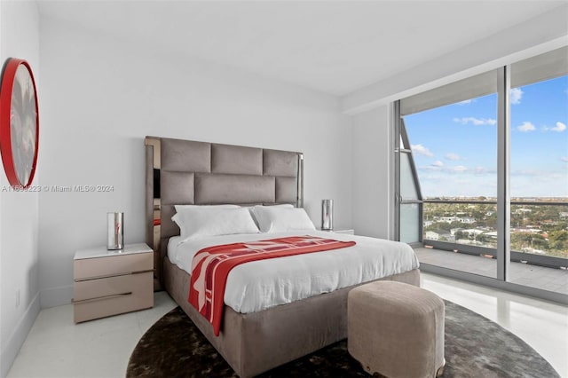 bedroom featuring access to outside and multiple windows