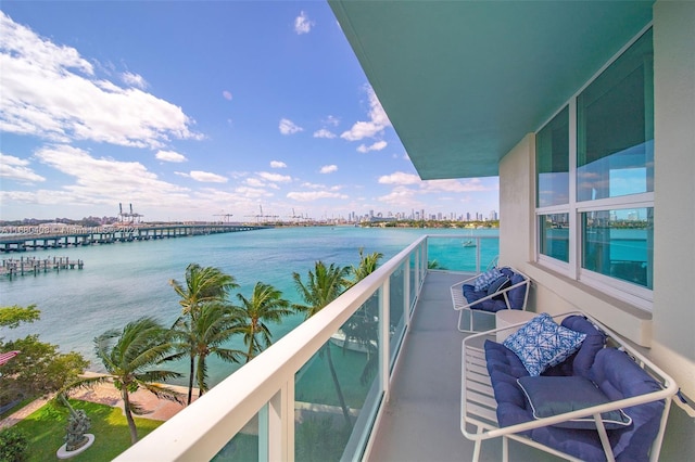 balcony featuring a water view