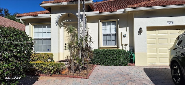 property entrance with a garage