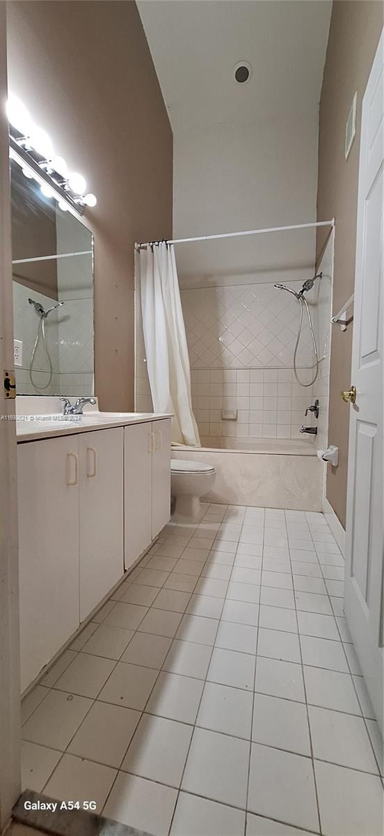 full bathroom with tile patterned flooring, vanity, toilet, and shower / tub combo with curtain