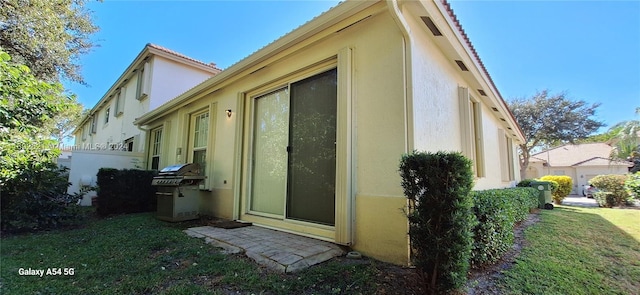 rear view of house with a lawn