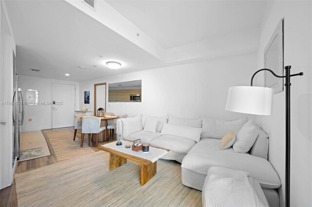 121 NE 34th St Unit 3014, Miami, FL 33137 - living area with light wood-style flooring and recessed lighting