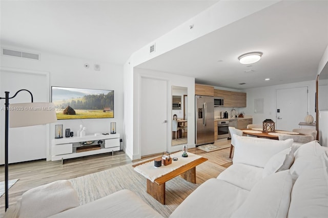121 NE 34th St Unit 3014, Miami, FL 33137 - living room with light wood finished floors
