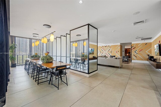 121 NE 34th St Unit 3014, Miami, FL 33137 - dining area featuring floor to ceiling windows and wood walls
